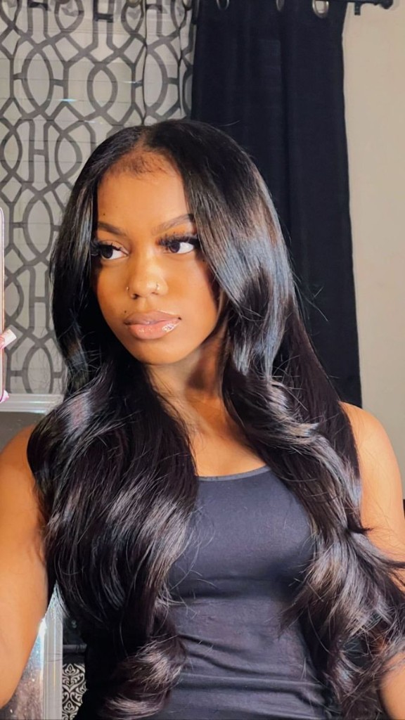 Client with long sew-in waves and natural hairline